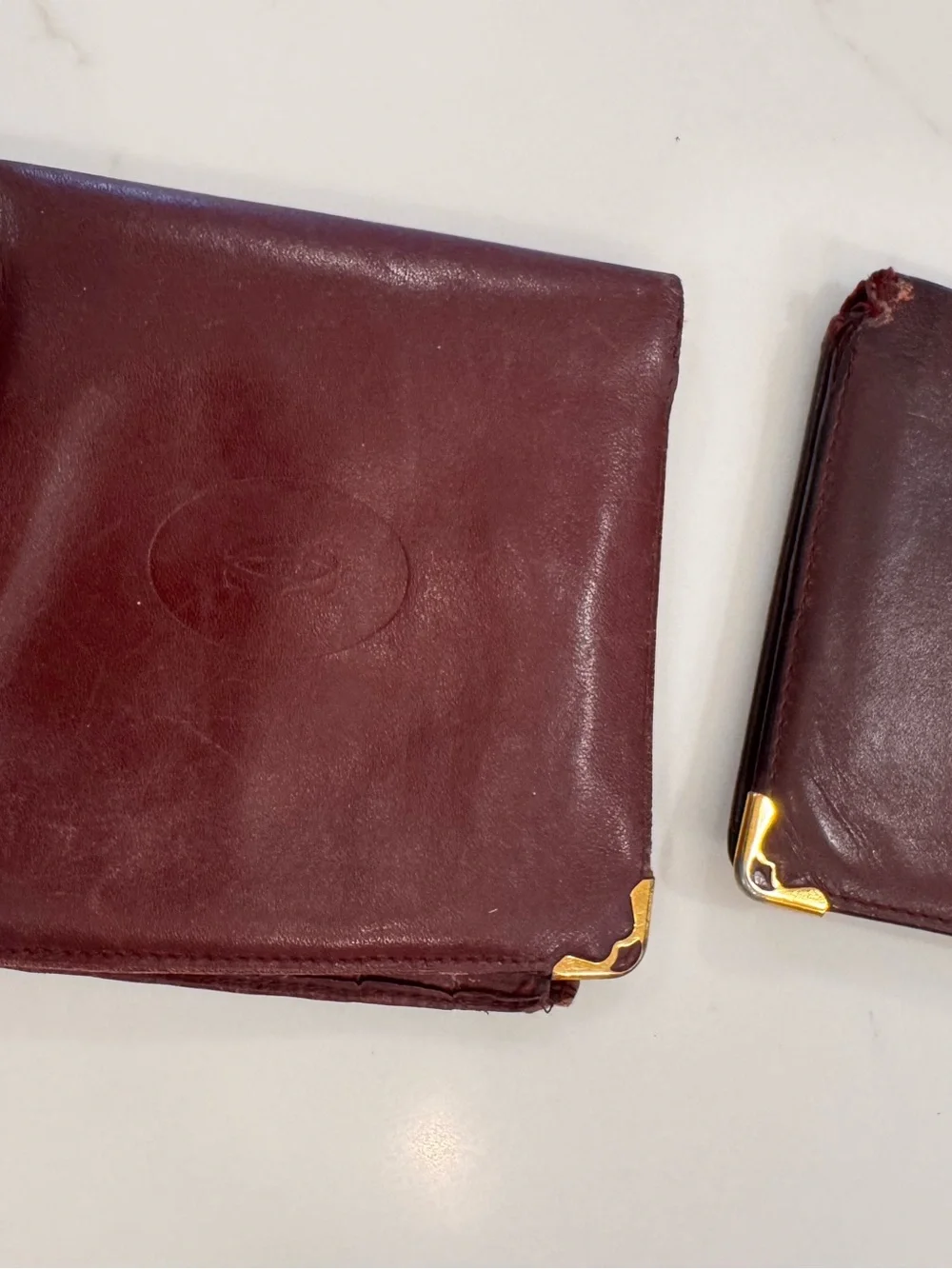 TWO!!! Cartier Men's Bifold Wallets in Burgundy with Gold Corner Accents